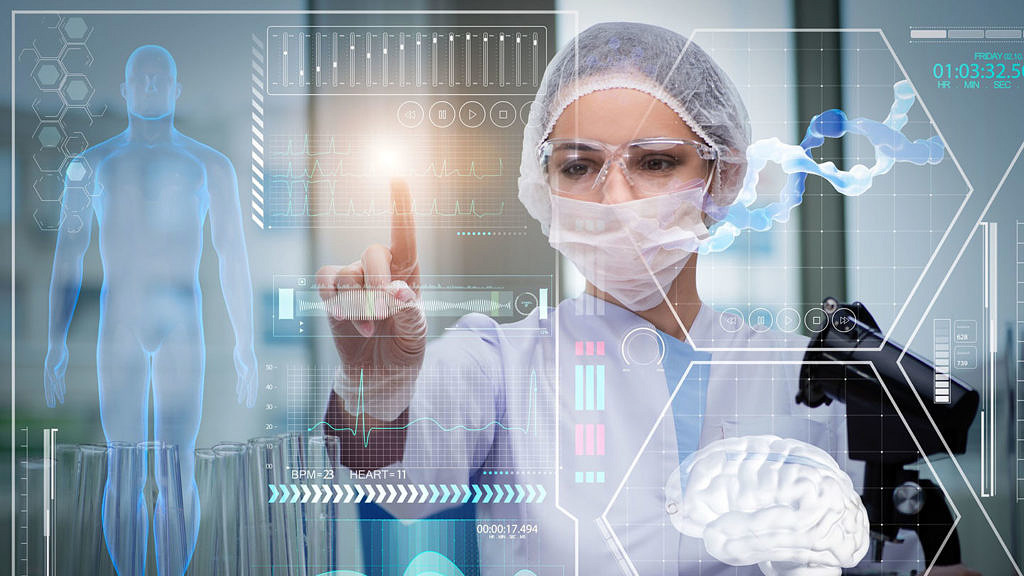 Doctor in futuristic medical concept pressing button.